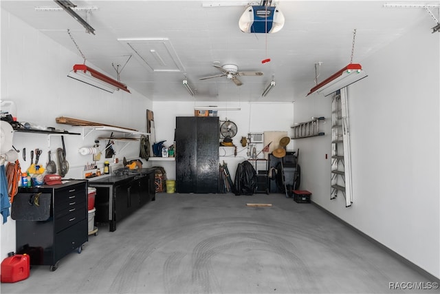 garage with a workshop area, ceiling fan, and a garage door opener