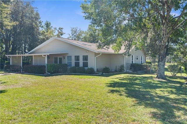 ranch-style house with a front lawn