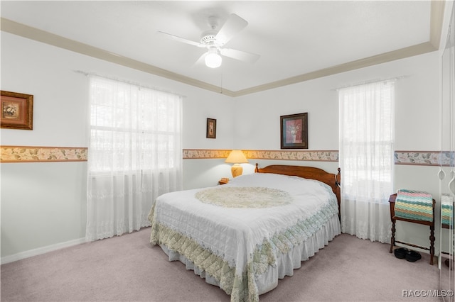 bedroom featuring light colored carpet and ceiling fan