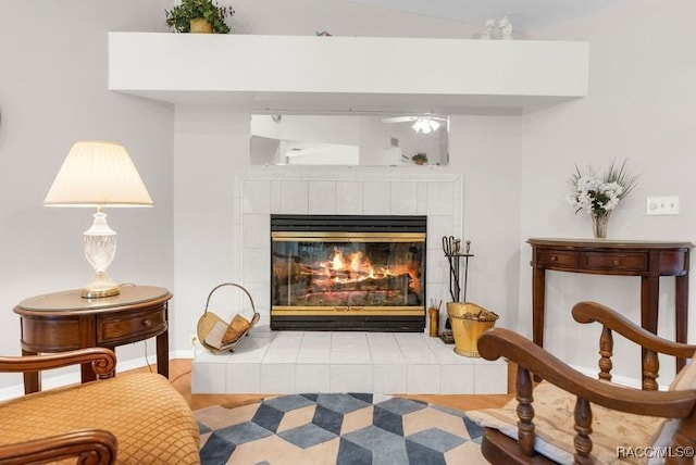 sitting room featuring light hardwood / wood-style flooring and a tiled fireplace