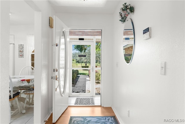 entryway with light hardwood / wood-style flooring