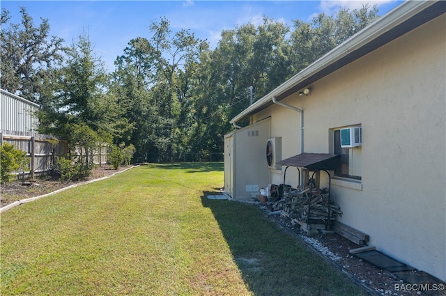 view of yard featuring a wall mounted air conditioner