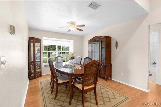 dining room featuring ceiling fan and light hardwood / wood-style flooring