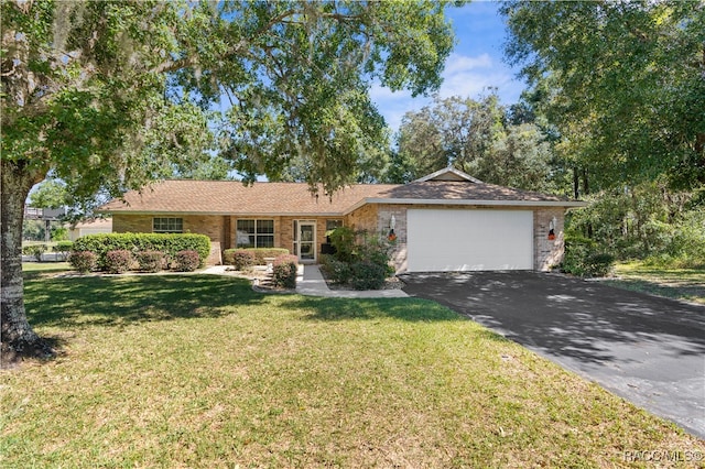 ranch-style house with a garage and a front yard