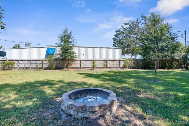 view of yard featuring a fire pit