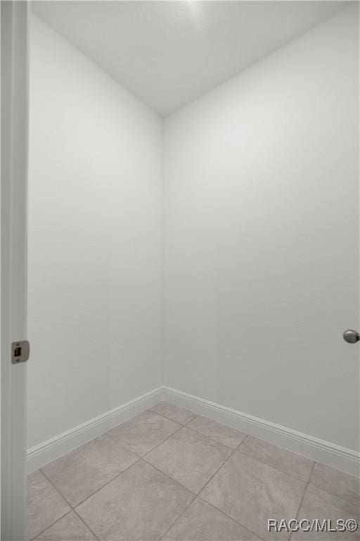 spare room with light tile patterned flooring