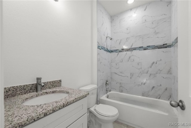 full bathroom with tiled shower / bath, vanity, and toilet