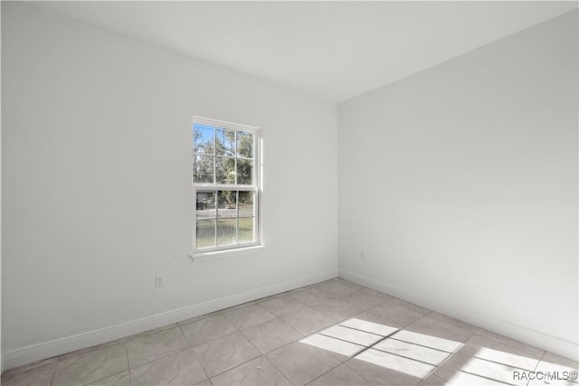 unfurnished room with light tile patterned floors