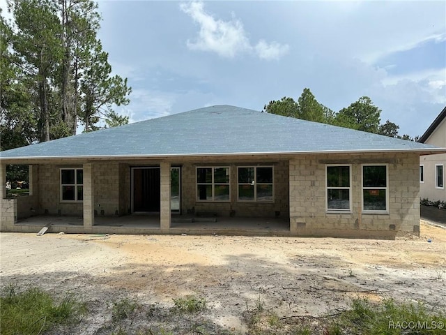 back of property with a patio area