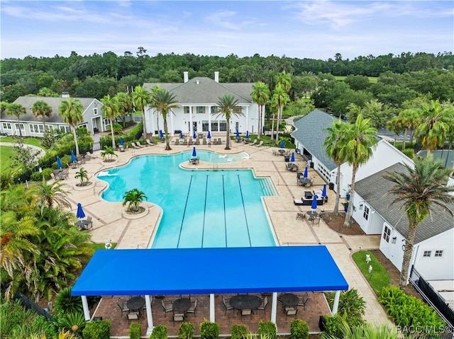 view of swimming pool with a patio area