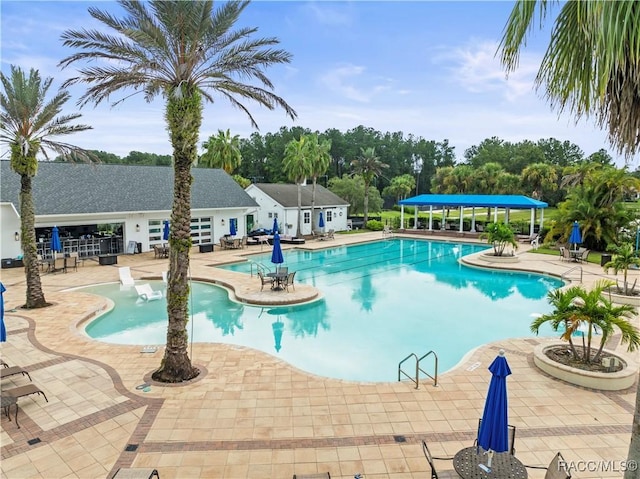 view of swimming pool featuring a patio area