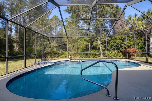 view of swimming pool with a patio and glass enclosure