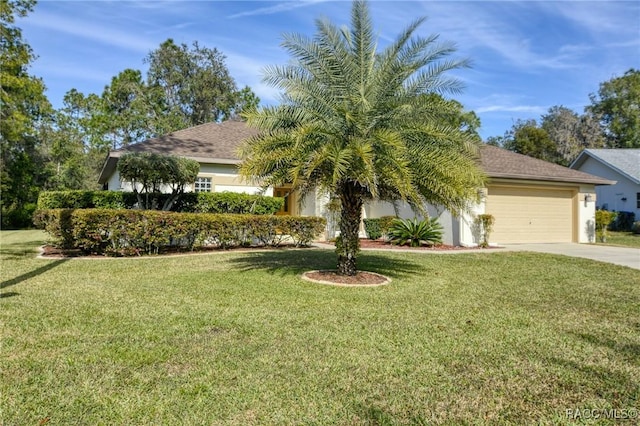 view of property hidden behind natural elements featuring a front yard and a garage