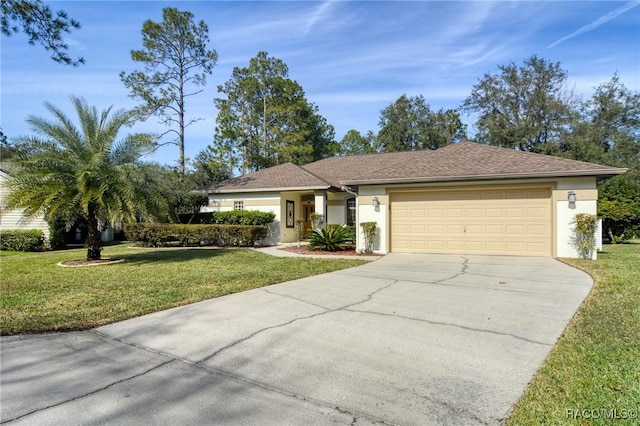 single story home featuring a garage and a front yard