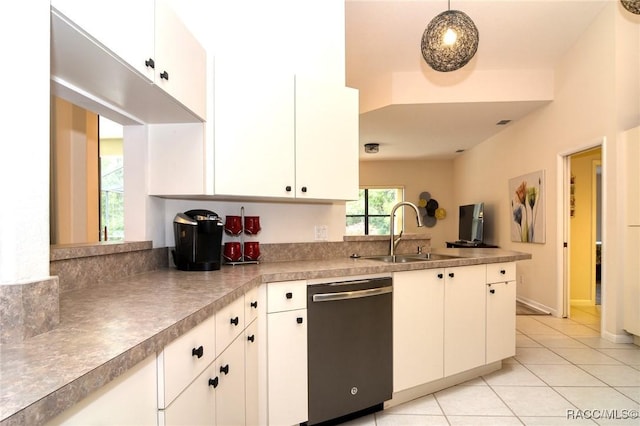 kitchen with sink, white cabinets, stainless steel dishwasher, pendant lighting, and light tile patterned flooring