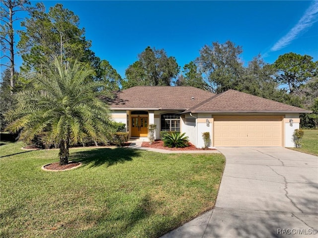 ranch-style home with a garage and a front yard