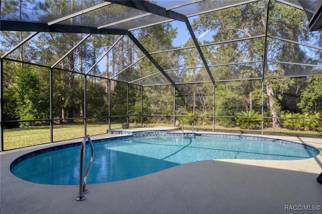 view of swimming pool with glass enclosure and a patio area