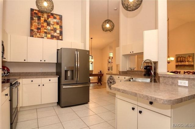 kitchen featuring white cabinets, sink, and stainless steel refrigerator with ice dispenser