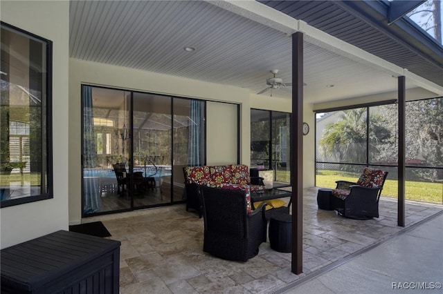 sunroom / solarium with ceiling fan