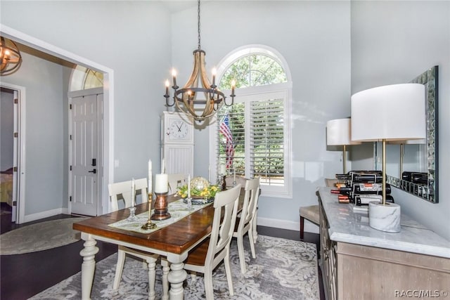 dining space with an inviting chandelier