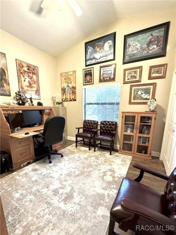 office with ceiling fan and lofted ceiling