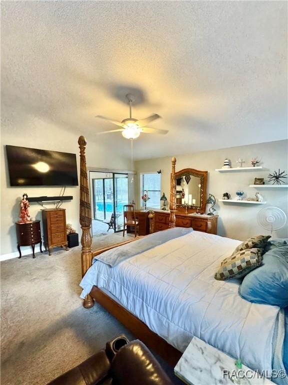 carpeted bedroom featuring ceiling fan and a textured ceiling