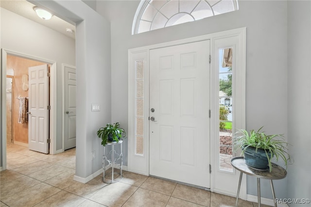 entrance foyer with light tile patterned floors