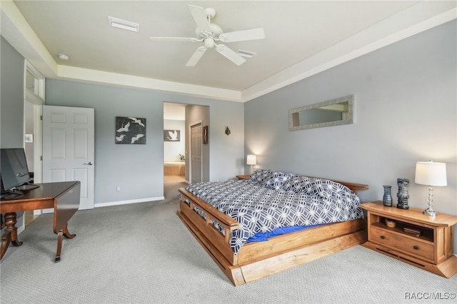 bedroom featuring carpet, ceiling fan, and connected bathroom