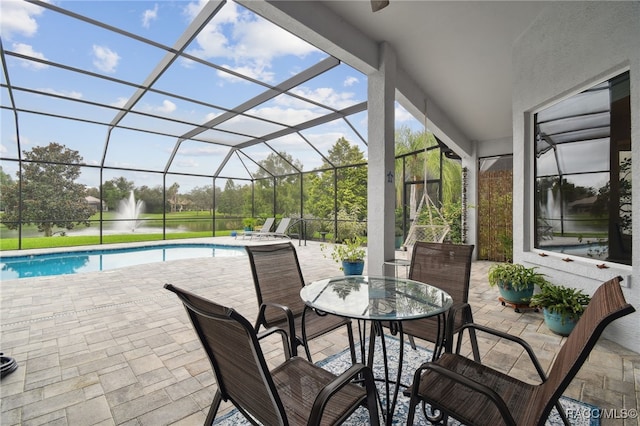 1049 W Lake Valley Ct, Hernando, FL 34442 - view of patio / terrace with an outdoor pool, outdoor dining area, and glass enclosure