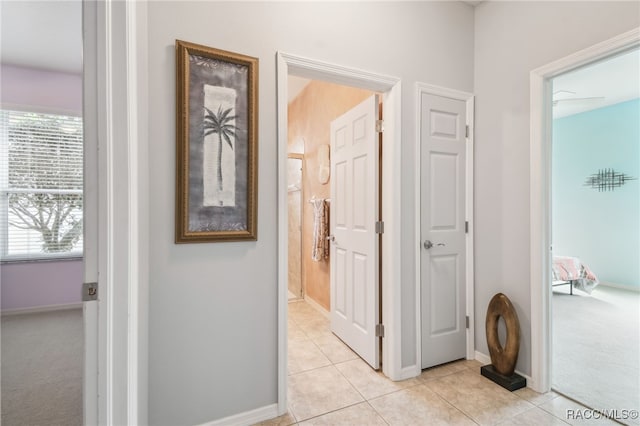 hallway with light tile patterned floors