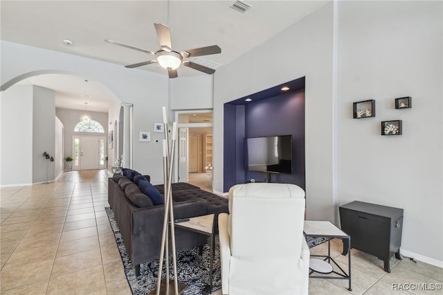 living room with ceiling fan and light tile patterned flooring