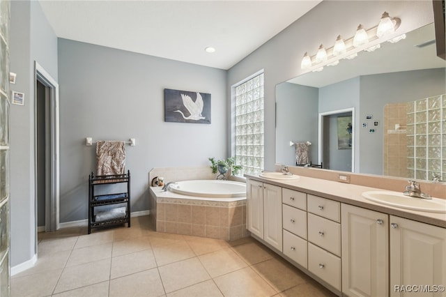 bathroom featuring tile patterned flooring, vanity, and independent shower and bath