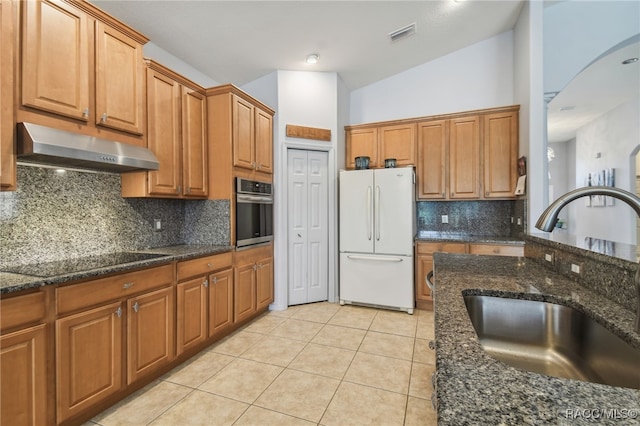 kitchen with black electric cooktop, sink, white refrigerator, oven, and lofted ceiling