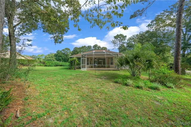 view of yard featuring a lanai