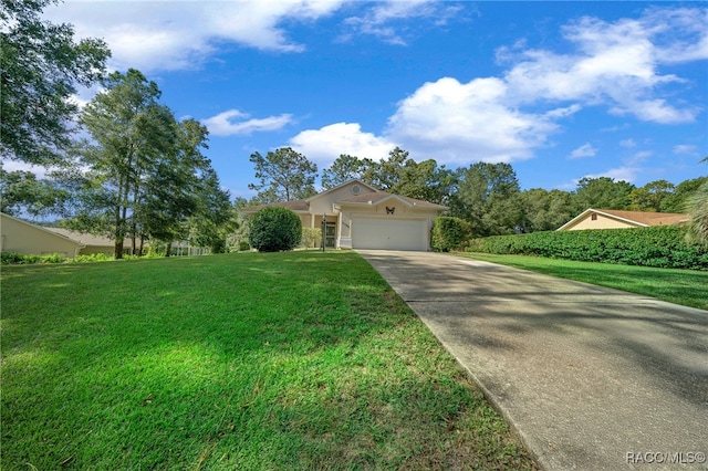 view of front of house with a garage and a front lawn