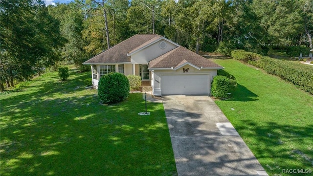 view of front of home featuring a front yard and a garage