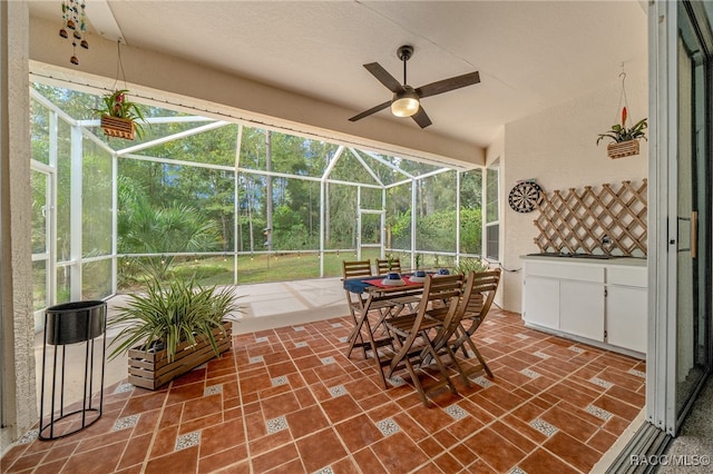 view of patio with ceiling fan and a lanai