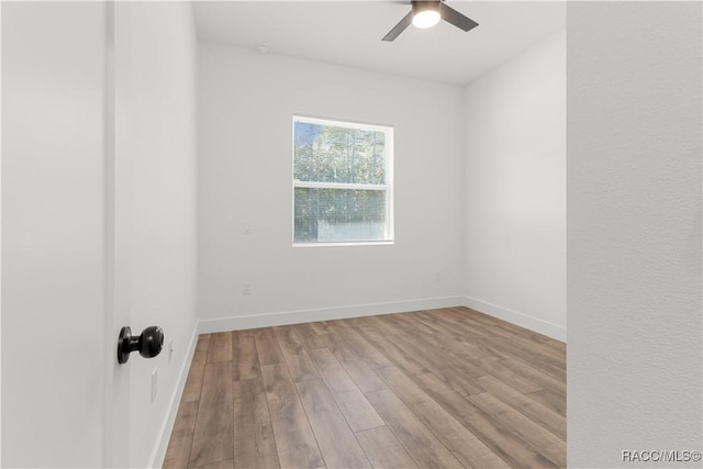 empty room featuring light hardwood / wood-style floors and ceiling fan