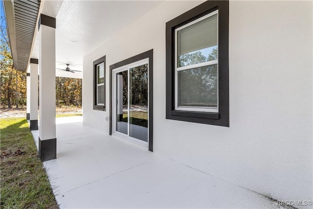 view of patio featuring ceiling fan