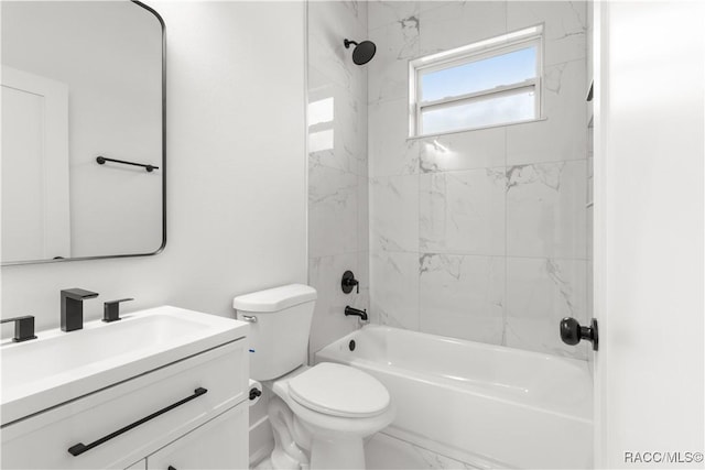 full bathroom featuring vanity, toilet, and tiled shower / bath