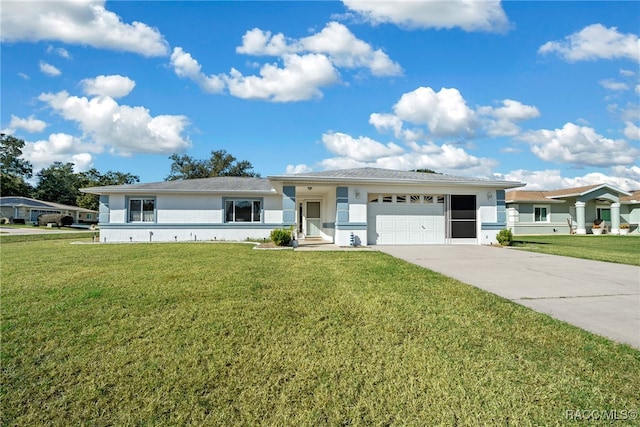 view of front of home featuring a front yard and a garage