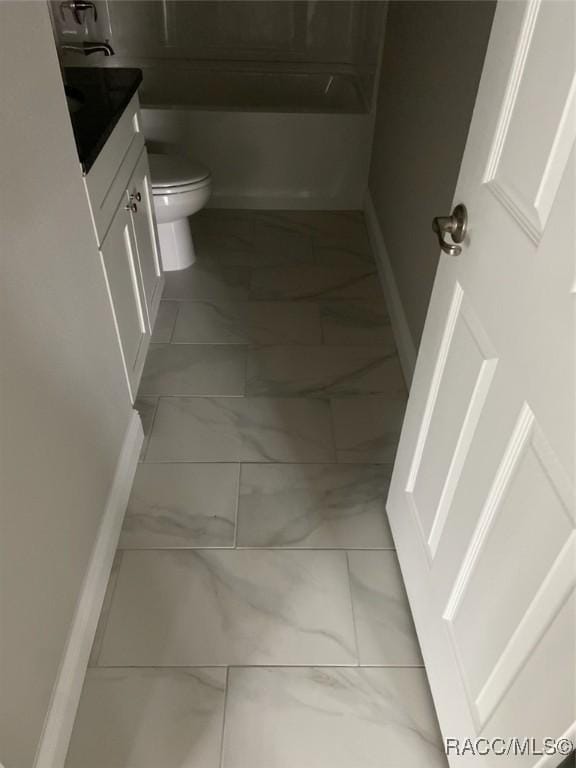 bathroom with vanity and toilet