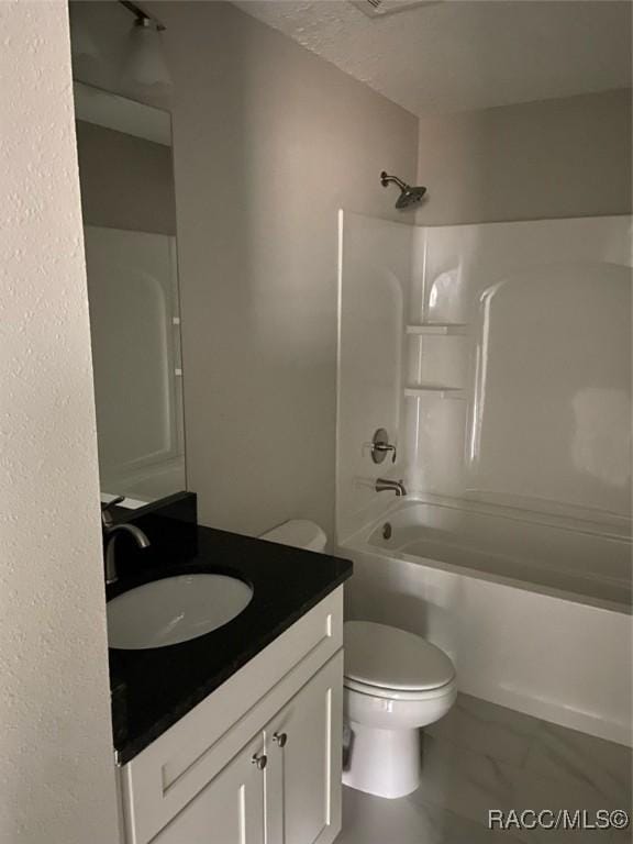 full bathroom with bathing tub / shower combination, vanity, and toilet