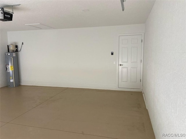 garage with electric water heater and a garage door opener