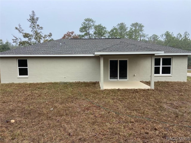 rear view of property featuring a patio