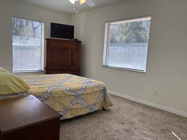 bedroom featuring ceiling fan and carpet flooring