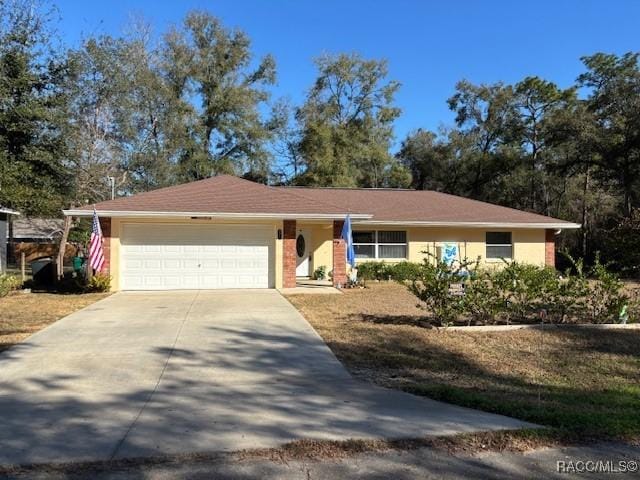 single story home featuring a garage