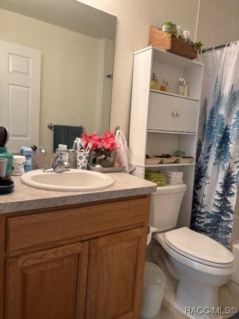 full bathroom featuring shower / tub combo with curtain, vanity, toilet, and tile patterned flooring