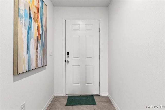 457 W Fairways View Dr, Beverly Hills, FL 34465 - doorway to outside with light tile patterned floors and baseboards