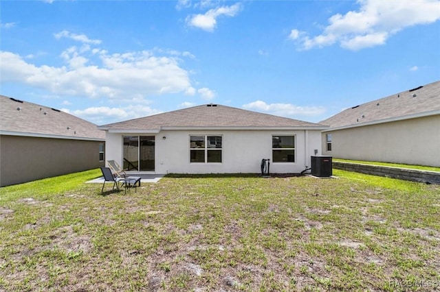 457 W Fairways View Dr, Beverly Hills, FL 34465 - rear view of property featuring central air condition unit, stucco siding, and a yard